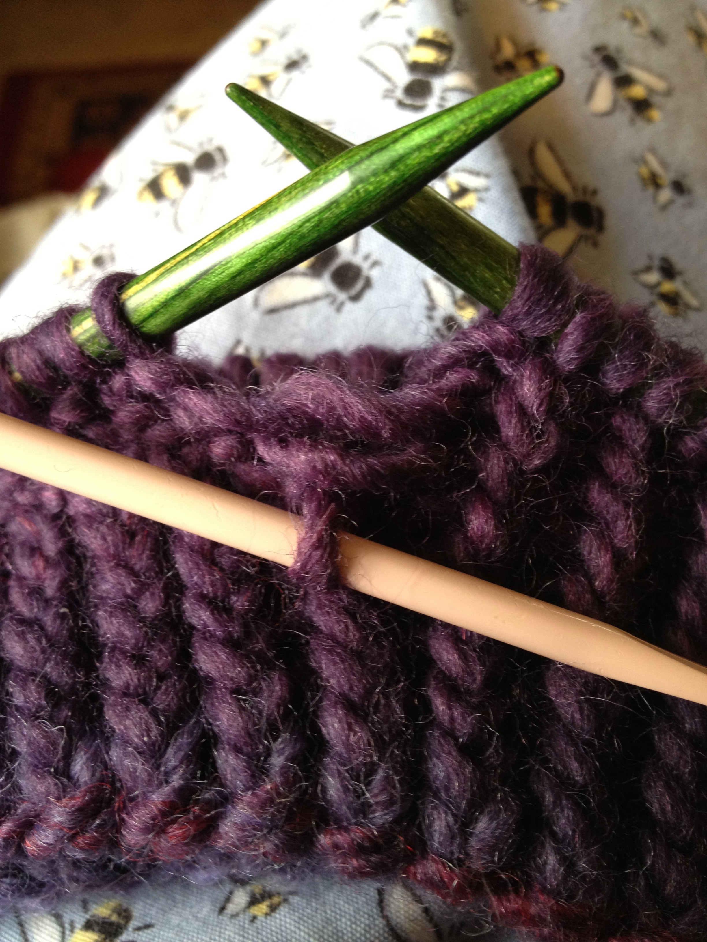 The stitch on the pink crochet hook is the dropped stitch.