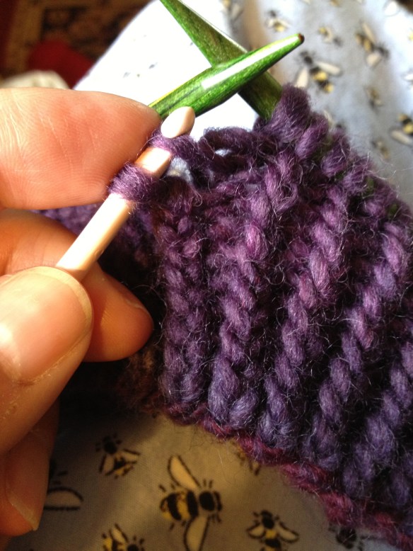 Pull the next stitch through from the back to the front. (You've inserted the crochet hook in from the front, too)