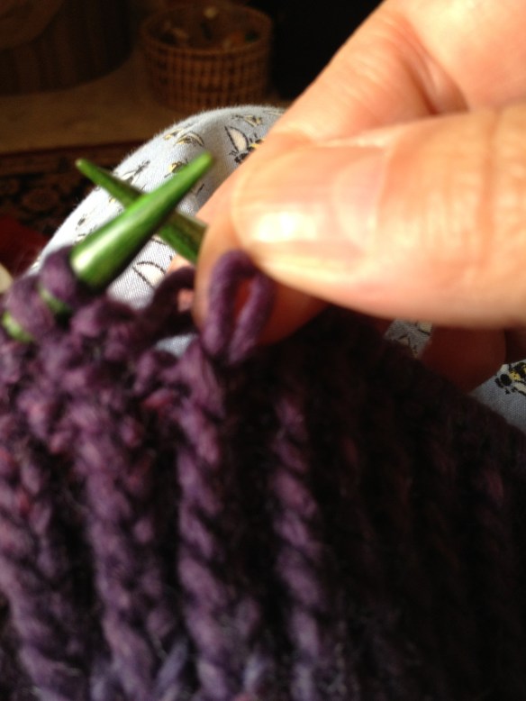 Twist the knitted stitch(es) one half twist to the back or to the right before inserting the crochet hook