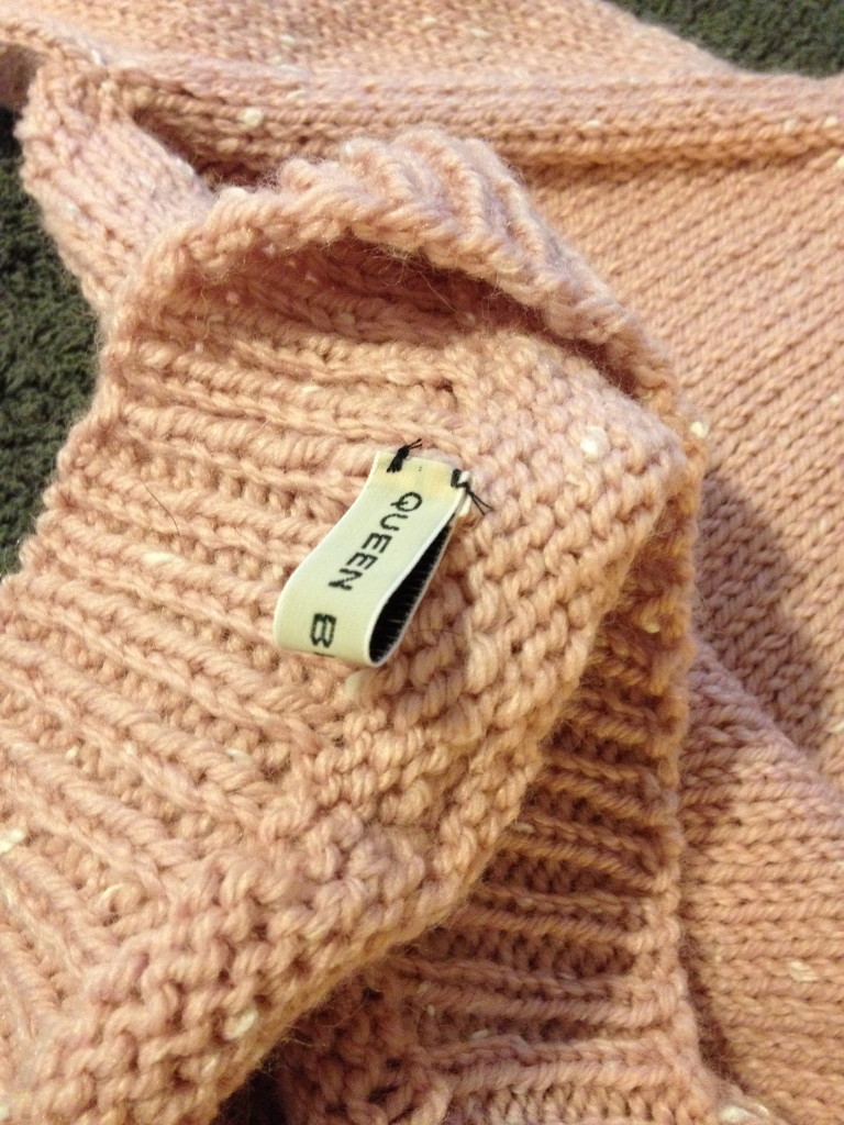 Queen Bee Knits label is placed on the inside of the bottom … don't want it rubbing baby's neck!