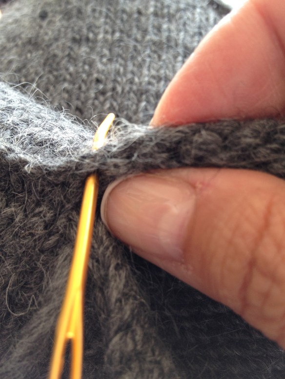 Sew up on the left side of the purl bump.