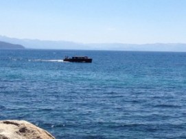 Old wooden boat on the lake. 