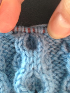 8-stitch cable with one side leaning right and one side leaning left 